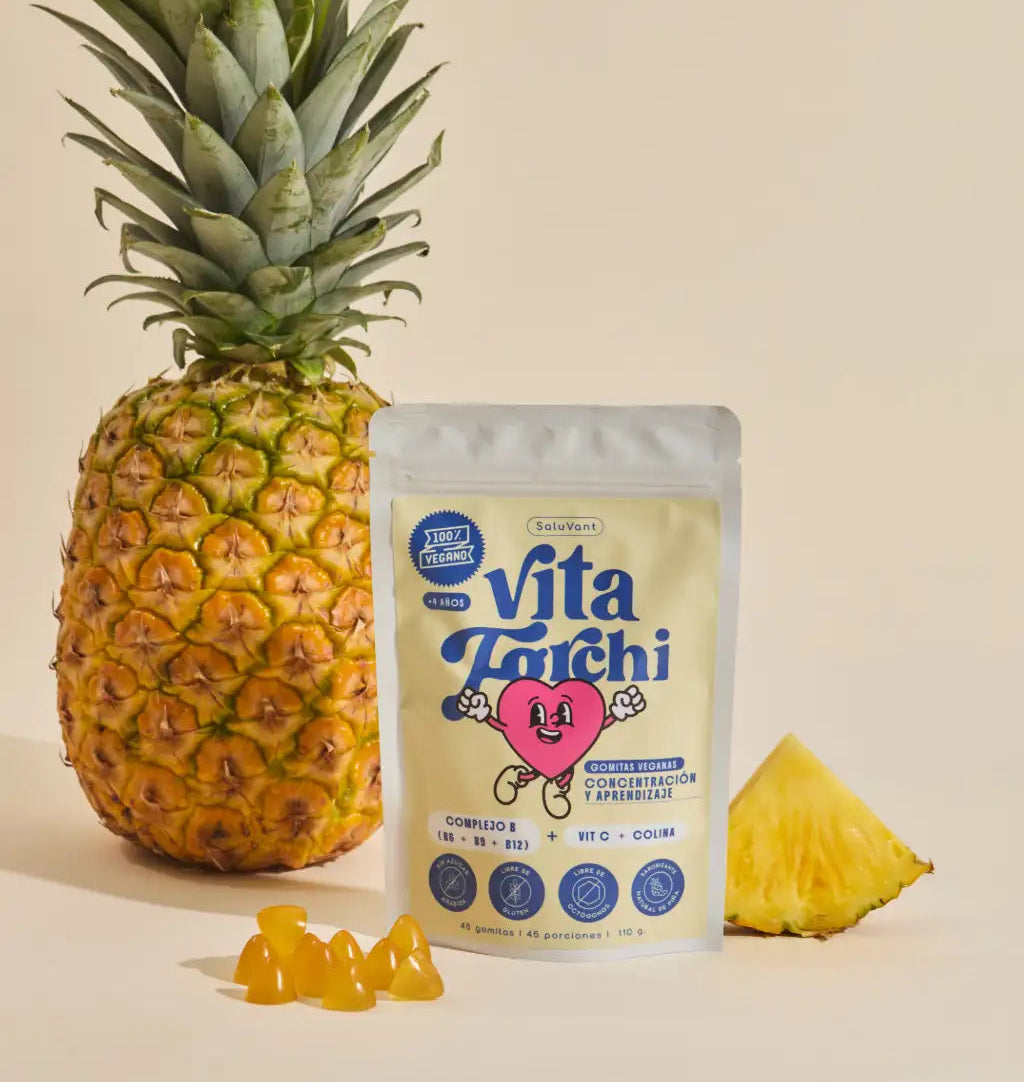 image de producto vitaforchi junto a una fruta piña